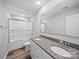 This bathroom features a double sink with granite countertop and a shower-tub at 113 Fosters Glen Pl, Mooresville, NC 28115