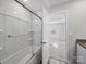 This bathroom features a tub with sliding glass doors and wood look flooring at 113 Fosters Glen Pl, Mooresville, NC 28115