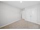 This bedroom features plush carpet, a closet, and neutral walls at 113 Fosters Glen Pl, Mooresville, NC 28115