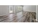 Well-lit room featuring a door to the outside patio and a large window at 113 Fosters Glen Pl, Mooresville, NC 28115