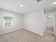 Carpeted bedroom with a window that brings in lots of natural light at 113 Fosters Glen Pl, Mooresville, NC 28115