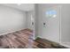 Inviting foyer features stylish floors and a bright front door at 113 Fosters Glen Pl, Mooresville, NC 28115