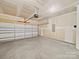 Spacious unfinished garage with overhead door and room for vehicles and storage at 113 Fosters Glen Pl, Mooresville, NC 28115