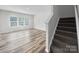 Spacious living room features a staircase and a large window at 113 Fosters Glen Pl, Mooresville, NC 28115
