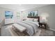 Cozy main bedroom with soft lighting, neutral tones and stylish decor at 113 Fosters Glen Pl, Mooresville, NC 28115