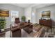 Bright home office featuring a modern desk and ample natural light at 113 Fosters Glen Pl, Mooresville, NC 28115