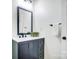 Chic bathroom boasting contemporary fixtures, an ornate vanity with a black framed mirror, and elegant decor at 113 Woodside Ave, Gastonia, NC 28054