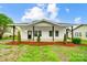 Charming renovated home with a welcoming front porch and new landscaping at 113 Woodside Ave, Gastonia, NC 28054