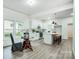 Modern kitchen featuring stainless steel appliances, quartz countertops, and a large island at 113 Woodside Ave, Gastonia, NC 28054