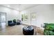 Bright living room featuring light-colored walls, hardwood flooring, and natural light at 113 Woodside Ave, Gastonia, NC 28054