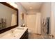 Functional bathroom with a vanity sink, shower, and tub with white accents at 115 Stumpy Creek Rd, Mooresville, NC 28117