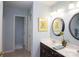 Clean and bright bathroom with double sinks, framed mirror, and fresh paint at 115 Stumpy Creek Rd, Mooresville, NC 28117