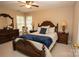 Comfortable bedroom featuring a ceiling fan, matching furniture, and ample natural light at 115 Stumpy Creek Rd, Mooresville, NC 28117