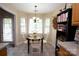 Bright dining area with a bay window and classic chandelier, perfect for Gathering meals at 115 Stumpy Creek Rd, Mooresville, NC 28117