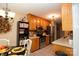 Well-lit kitchen featuring wooden cabinets, stainless steel appliances, and granite countertops at 115 Stumpy Creek Rd, Mooresville, NC 28117
