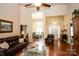 Elegant living room with hardwood floors and ample natural light, creating a warm and inviting atmosphere at 115 Stumpy Creek Rd, Mooresville, NC 28117