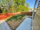 A spacious backyard is partially covered in a layer of straw for new grass at 1177 Ellis Pond Dr, Rock Hill, SC 29730