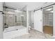 Elegant bathroom features a glass-enclosed shower, soaking tub, and stylish tile flooring at 1177 Ellis Pond Dr, Rock Hill, SC 29730