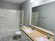 Well-lit bathroom with dual sinks and shower-tub combination at 1177 Ellis Pond Dr, Rock Hill, SC 29730