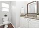 Clean bathroom featuring white vanity, granite countertop, and neutral wall paint, providing a serene space at 1177 Ellis Pond Dr, Rock Hill, SC 29730
