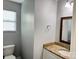 Bathroom showcasing granite counters, wood-trimmed mirror, and a vanity with white cabinets at 1177 Ellis Pond Dr, Rock Hill, SC 29730