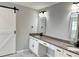 Bathroom boasts a double vanity with granite countertops and modern lighting fixtures at 1177 Ellis Pond Dr, Rock Hill, SC 29730