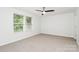 Sunlit bedroom with two windows and plush carpeting at 1177 Ellis Pond Dr, Rock Hill, SC 29730