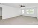 Spacious bedroom with neutral carpet, ceiling fan, and ample natural light at 1177 Ellis Pond Dr, Rock Hill, SC 29730