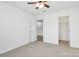 Clean bedroom featuring a ceiling fan, neutral carpet, and access to a closet at 1177 Ellis Pond Dr, Rock Hill, SC 29730