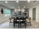 Open dining area with adjacent kitchen, modern table setting, and natural light from nearby windows at 1177 Ellis Pond Dr, Rock Hill, SC 29730