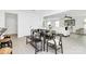Open concept dining area with a modern table set, leading to the living room, perfect for entertaining at 1177 Ellis Pond Dr, Rock Hill, SC 29730