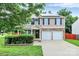 Inviting two-story home with stone accents, solar panels, and a well-manicured lawn at 1177 Ellis Pond Dr, Rock Hill, SC 29730