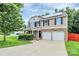 Charming home featuring a stone-accented facade, solar panels, and a spacious driveway at 1177 Ellis Pond Dr, Rock Hill, SC 29730