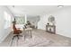Sun-filled home office with a neutral palette, hardwood floors, and contemporary furniture at 1177 Ellis Pond Dr, Rock Hill, SC 29730