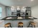 Modern kitchen island with bar stool seating, sleek countertops, and stainless steel appliances at 1177 Ellis Pond Dr, Rock Hill, SC 29730