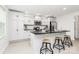 Well-equipped kitchen with white cabinetry, granite countertops, stainless steel appliances, and a central island with stools at 1177 Ellis Pond Dr, Rock Hill, SC 29730