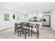 Bright kitchen featuring white cabinets, stainless steel appliances and a dining table for a cozy atmosphere at 1177 Ellis Pond Dr, Rock Hill, SC 29730