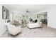 Open-concept living room with hardwood floors, stylish furniture, and ample natural light at 1177 Ellis Pond Dr, Rock Hill, SC 29730