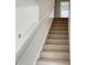 Carpeted staircase with white railing at 1177 Ellis Pond Dr, Rock Hill, SC 29730