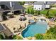 Aerial view of a backyard featuring a custom pool, patio, and outdoor dining area at 129 Hunts Landing Dr, Mooresville, NC 28117