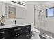 Contemporary bathroom features a sleek vanity with dark wood cabinets, modern fixtures, and a glass-enclosed shower at 129 Hunts Landing Dr, Mooresville, NC 28117