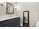 Bathroom showcasing a granite counter, vessel sink, and modern mirror at 129 Hunts Landing Dr, Mooresville, NC 28117