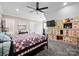 This bedroom features carpeted floors, a ceiling fan, and a wooden dresser at 129 Hunts Landing Dr, Mooresville, NC 28117