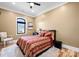 Traditional bedroom showcasing a bed with decorative pillows, hardwood floors, a neutral color scheme, and a cozy ambiance at 129 Hunts Landing Dr, Mooresville, NC 28117
