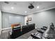 Home theater with leather recliners, large screen, projector, sound system, and raised platform seating at 129 Hunts Landing Dr, Mooresville, NC 28117