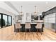Spacious kitchen with large island, pendant lighting, stainless steel appliances, and a view of the backyard at 129 Hunts Landing Dr, Mooresville, NC 28117