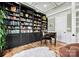 Charming library with custom built-in bookshelves and a unique writing desk at 129 Hunts Landing Dr, Mooresville, NC 28117