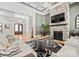 Inviting living room with stone fireplace, hardwood floors, and coffered ceilings at 129 Hunts Landing Dr, Mooresville, NC 28117