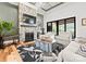 Bright living room with stone fireplace, hardwood floors, and large windows at 129 Hunts Landing Dr, Mooresville, NC 28117