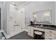 This luxury bathroom boasts a glass shower with gold accents, vanity with stool, and modern fixtures at 129 Hunts Landing Dr, Mooresville, NC 28117